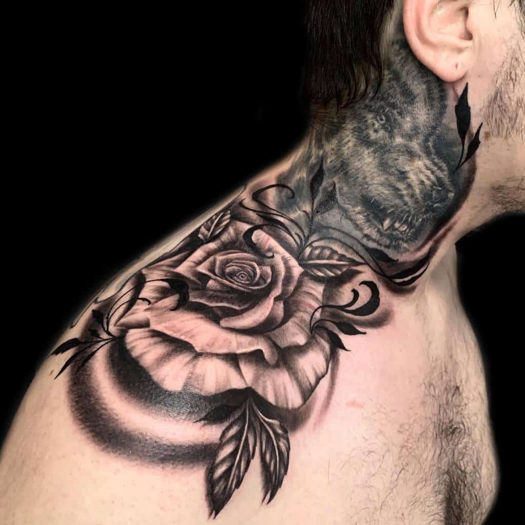 A stunning black and gray rose tattoo gracefully adorns the shoulder, with its intricate leaves extending onto the neck