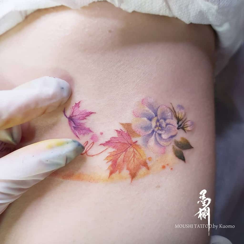 A delicate tattoo of leaves and a Jasmine flower
