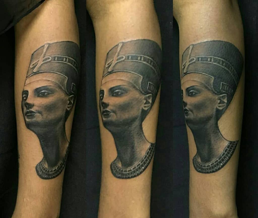 Tattoo of Queen Nefertiti's bust on an arm, depicted from multiple angles