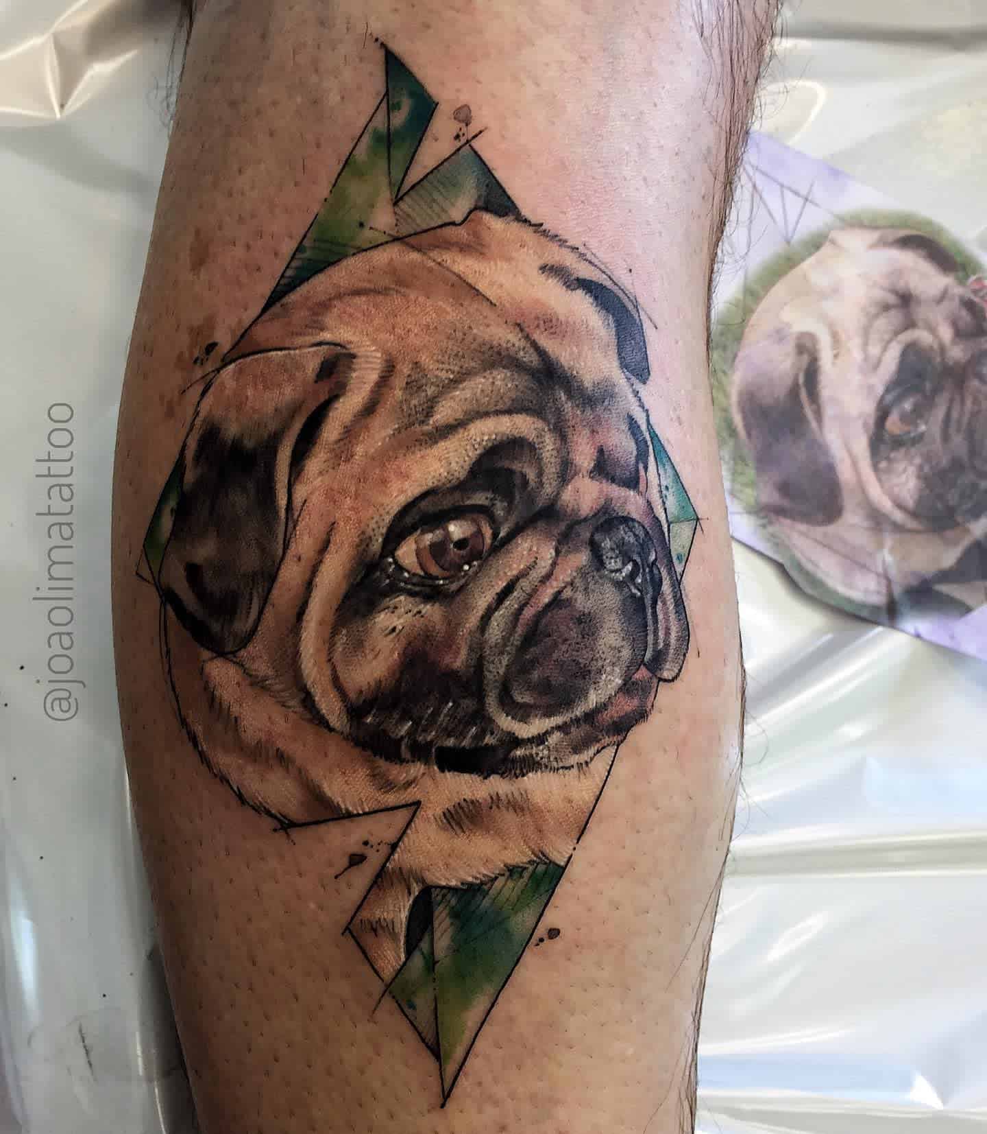 A realistic tattoo of a pug’s face with vibrant geometric shapes and splashes of color around it
