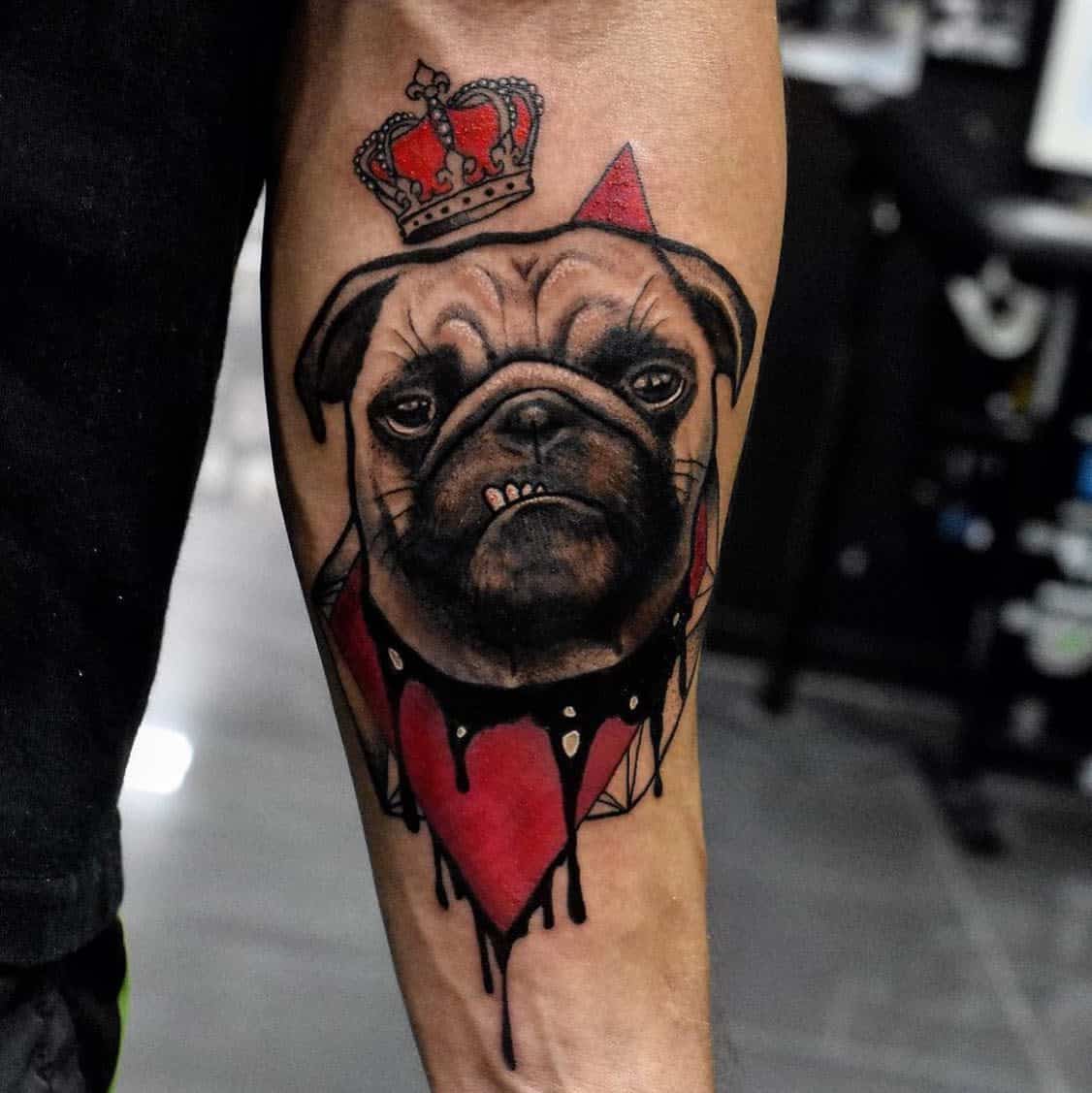A colorful tattoo of a pug wearing a red crown and a red collar, with dripping paint effects and geometric background