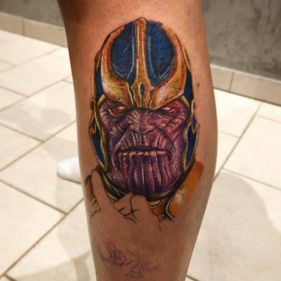 A vibrant tattoo of Thanos, with his intense expression and colorful details on his helmet