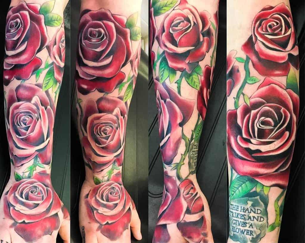 A vibrant sleeve of colorful rose tattoos beautifully adorns the forearm