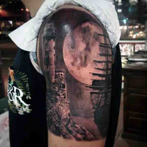 Realistic Sailing Ship Moon Tattoo With Lighthouse On Upper Arm
