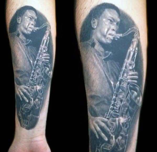 Realistic Shaded Black And Grey Portrait Saxophone Player Mens Inner Forearm Tattoo