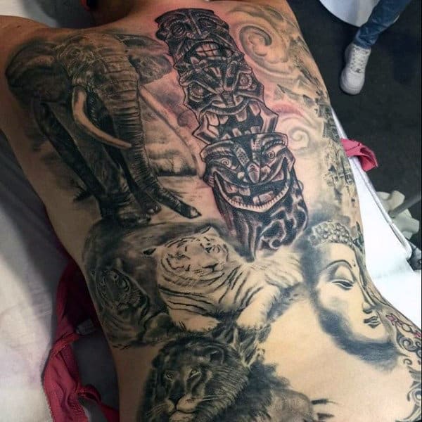 Realistic Totem Pole Surrounded By Animals Back Tattoo On Gentleman