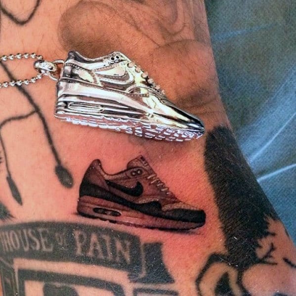 Realitic Mens Small Nike Shoe Tattoo On Arm