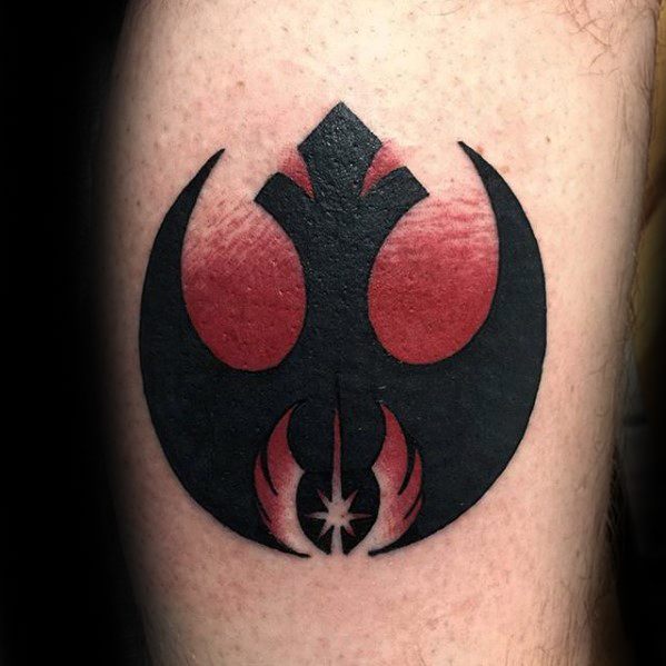 Tattoo of a black and red Star Wars Rebel Alliance symbol on an arm