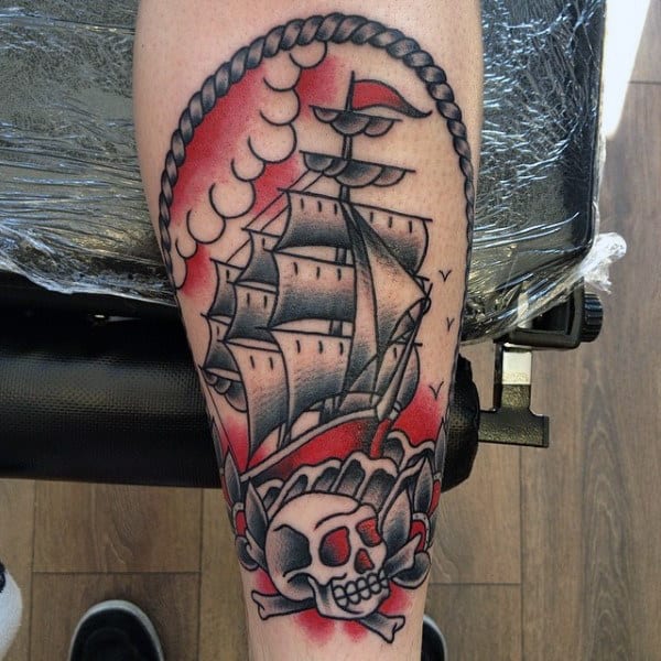 Red And Grey Ink Mens Skull With Ship Traditional Inner Forearm Tattoo