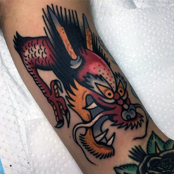 Red And Yellow Traditional Dragon Head Mens Arm Tattoo