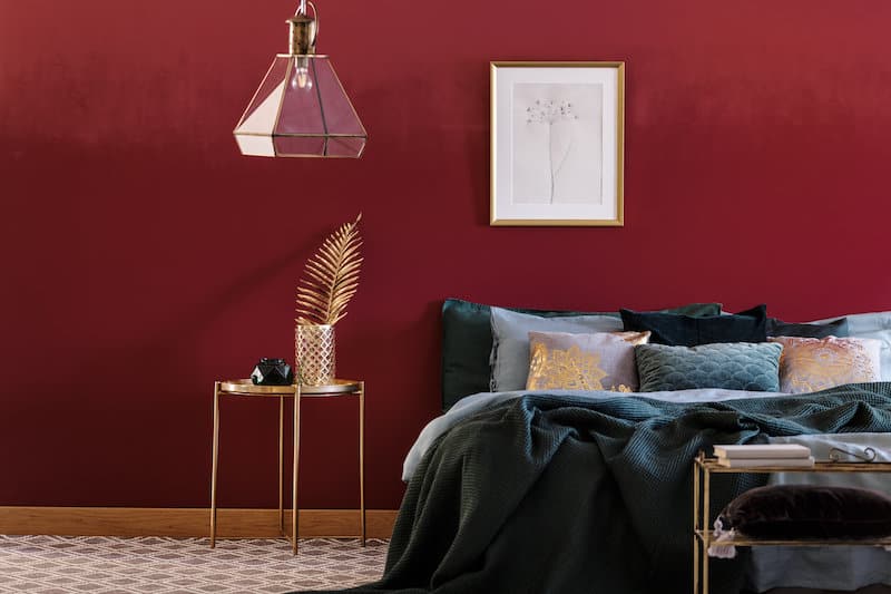 red accent wall in bedroom