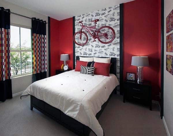 Red-themed bedroom with bike wall decor, a white bed, and checkered curtains by the window