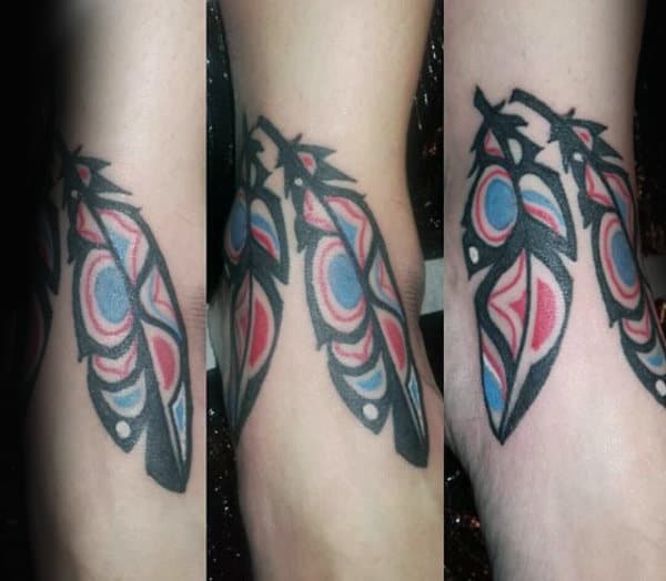 Red Blue Leafy Haida Tattoo Male Forearms