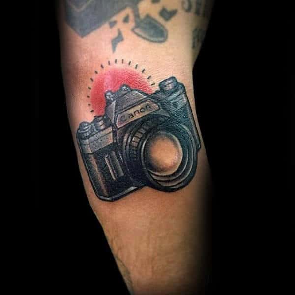 Red Glowing Canon Camera Tattoo Male Forearms