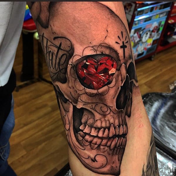 Red Heart Diamond Skull Eye Tattoo On Mans Arm