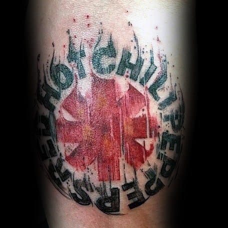 Tattoo featuring the Red Hot Chili Peppers logo with bold lettering, fiery flame details, and a distressed texture for a dynamic, intense look.