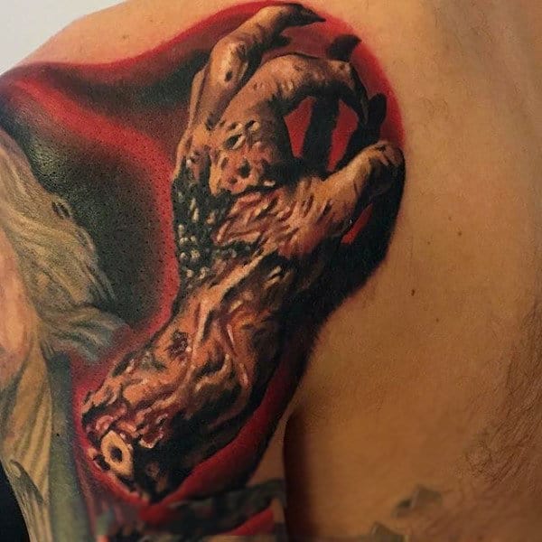 Red Ink Shaded Lifeless Zombie Hand Tattoo On Shoulder Of Male