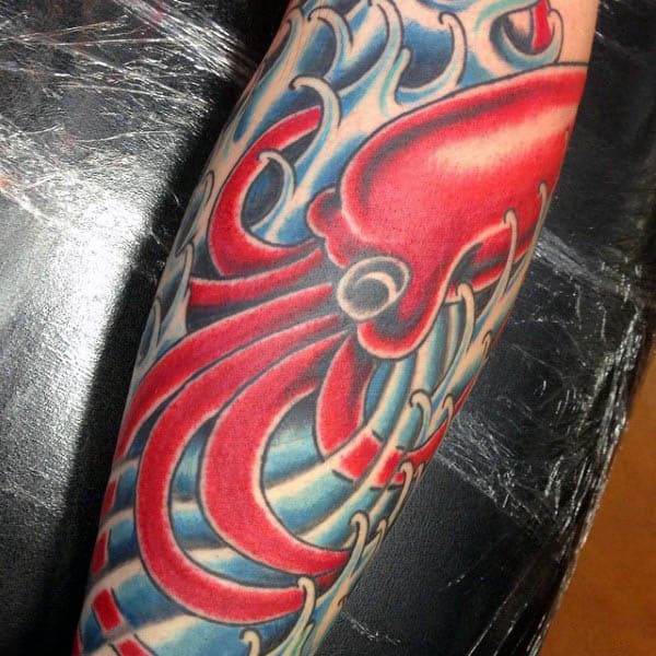 Red Squid With Blue Ocean Waves Tattoo For Men On Arm
