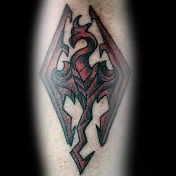 Tattoo of a Skyrim-inspired stylized dragon emblem with a red and black design