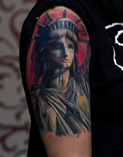 Red Upper Arm Statue Of Liberty Male Tattoos