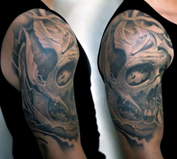 Detailed skull tattoo on an upper arm
