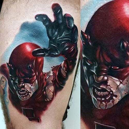 Intense Daredevil tattoo with a fierce expression, bloodied mouth, outstretched hand, and dramatic shading for a brutal action look.