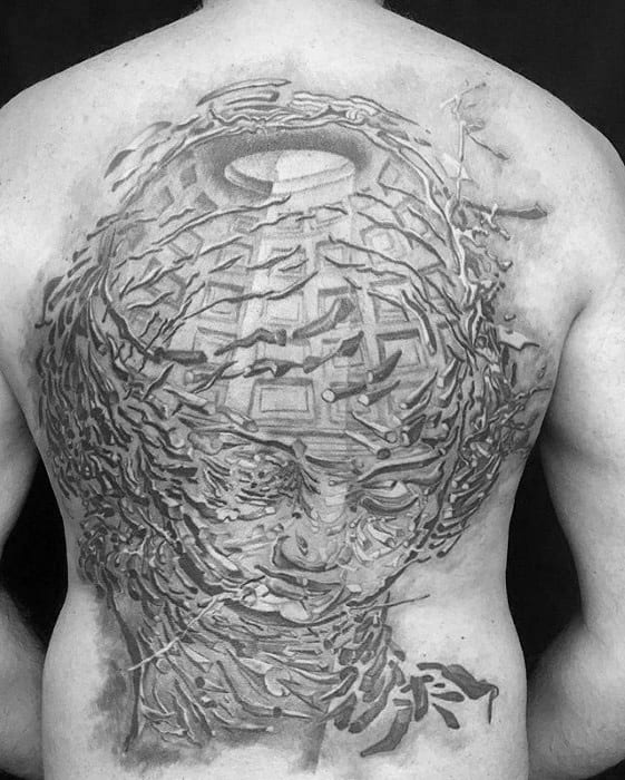 Intricate full back tattoo inspired by Salvador Dali, depicting a fragmented human face dissolving into geometric patterns and surreal textures.