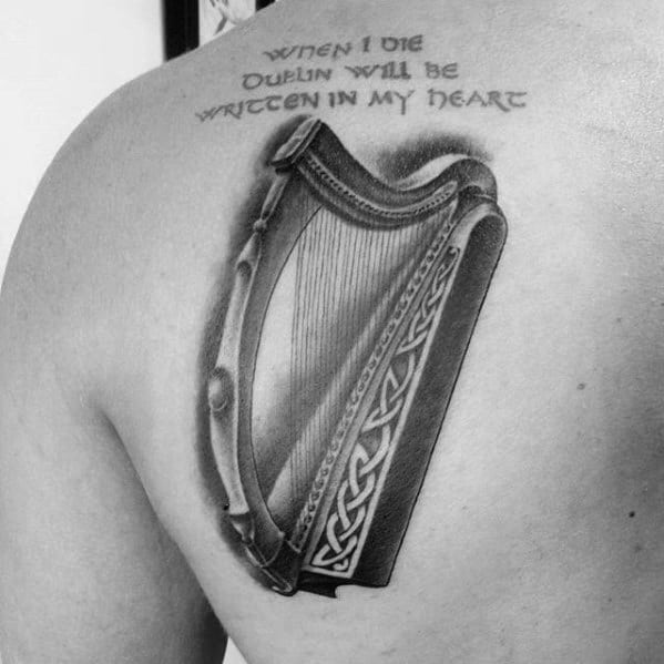 Remarkable Harp Tattoos For Males On Shoulder Blade