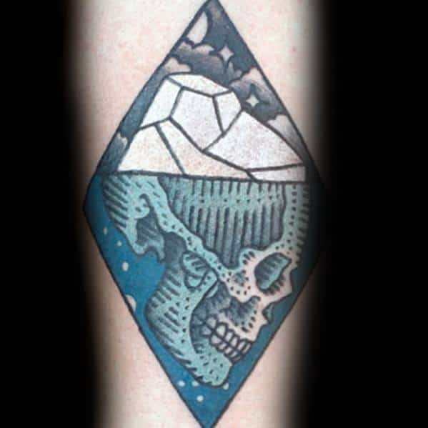 Bold diamond-shaped iceberg tattoo with a hidden skull beneath the waterline, symbolizing unseen depth and mystery.