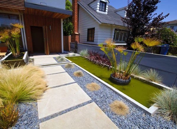 concrete steps with landscaping pebbles 
