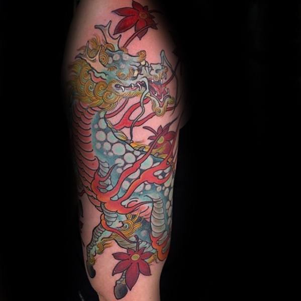Colorful Kirin tattoo with turquoise scales, golden mane, red flames, and vibrant red flowers, designed in a playful and bold Japanese style.