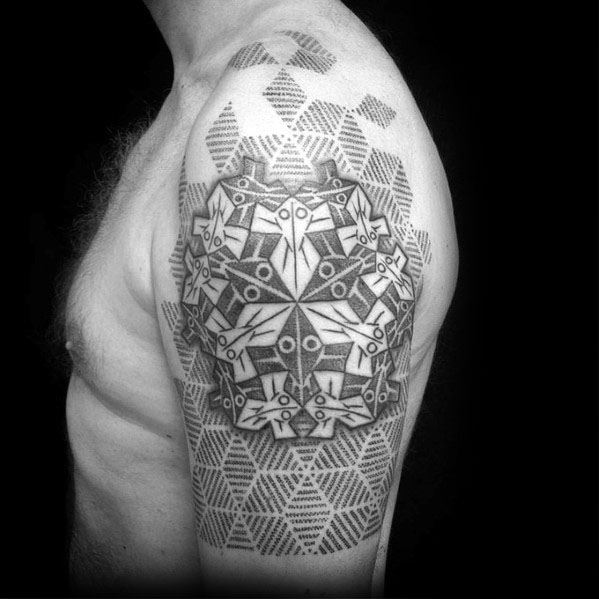 MC Escher-inspired upper arm tattoo featuring a geometric tessellation of abstract owl-like figures over a patterned hexagonal background.