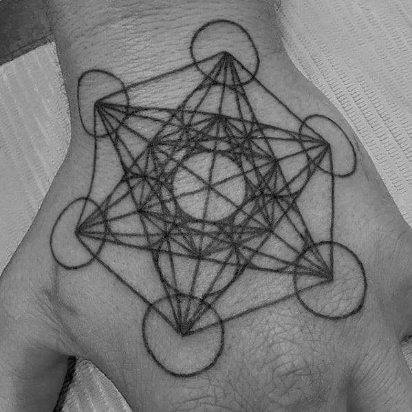 Metatron’s Cube hand tattoo with clean black linework and precise geometry, centered for a bold and spiritual statement design.