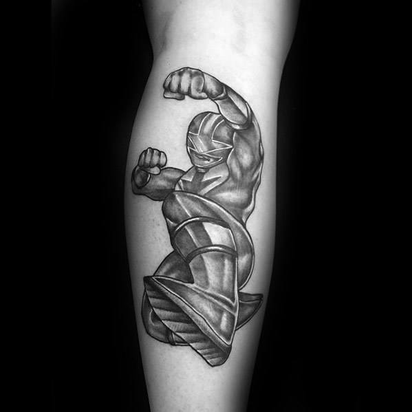 Black and grey tattoo of the Red Ranger in a dynamic mid-air punch pose, with bold muscle shading and strong comic-style linework.