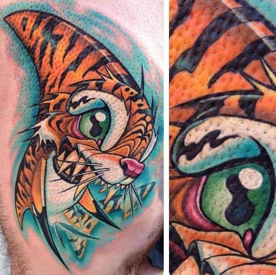 Colorful tiger shark hybrid tattoo with exaggerated features, bright green eye, sharp teeth, and electric blue background in a neo-traditional style.