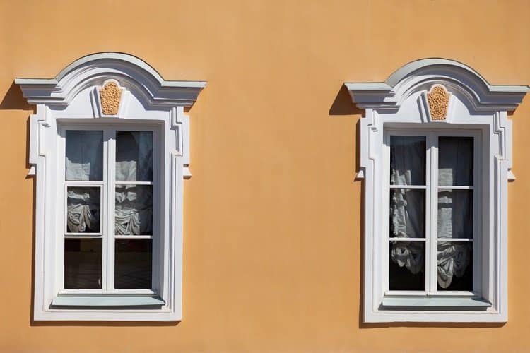 white renaissance window trim orange wall