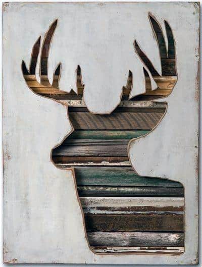 Rustic deer silhouette wall art made from repurposed wood planks in a framed design.