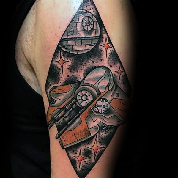 Tattoo featuring the Death Star and a vibrant orange starfighter, surrounded by glowing space elements