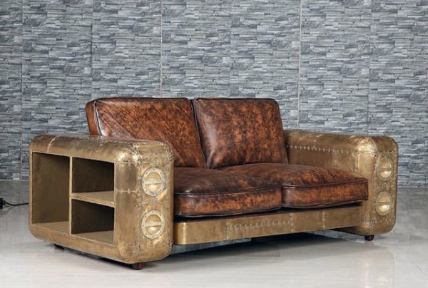 Vintage-style leather and metal sofa with storage, set against a gray textured wall