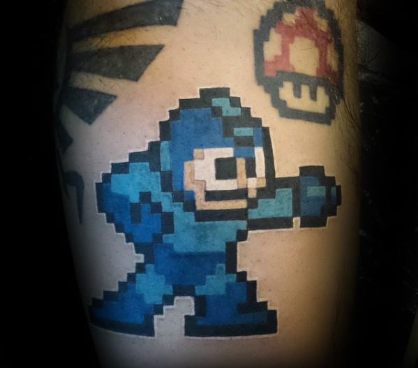 Retro Male 8 Bit Video Game Themed Tattoo Design Inspiration