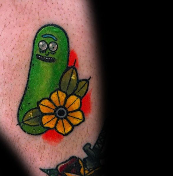 Pickle Rick tattoo with a bright yellow flower and bold green shading, featuring a simple yet playful design with a red background accent.
