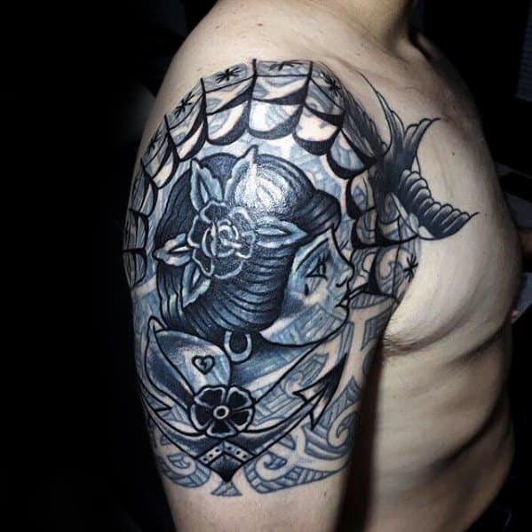 Sure! Here is an edited version of your request: "Blast over black and gray tattoo of a woman and bird on a man's shoulder