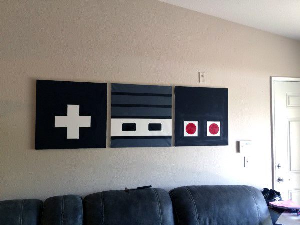 Wall art resembling a retro game controller with buttons and directional pad