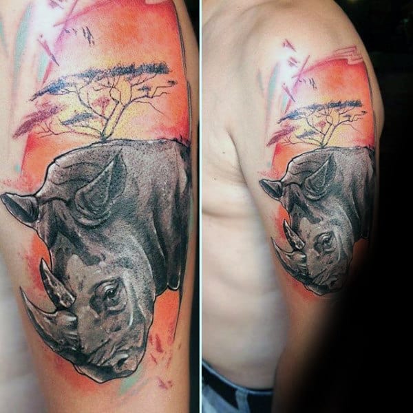 Rhino With Orange Sunset Sky Mens Upper Arm Tattoo