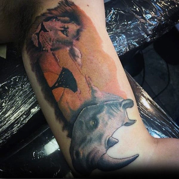 Rhino With Tree And Lion Mens Bicep Tattoos