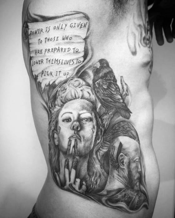 Detailed tattoo featuring Lagertha and Ragnar, a raven, and a Viking-inspired quote.