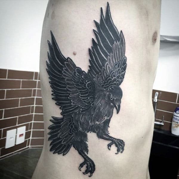 Rib Cage Side Tattoo Of Crow On Man