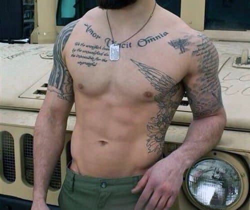 Shirtless person with tattoos on their chest and arms