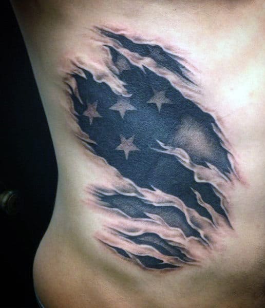 Tattoo of a torn American flag design on skin