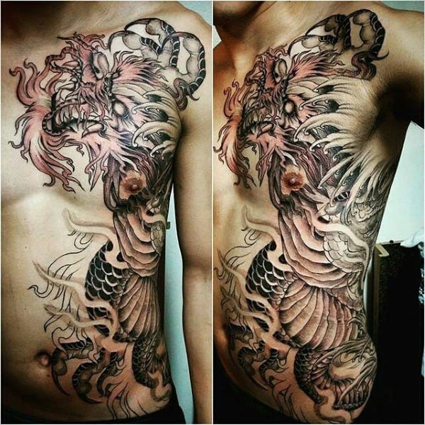Detailed dragon tattoo covering a man's chest and ribcage